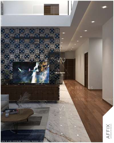 A refined living space anchored by a bold patterned feature wall, balanced with clean painted surfaces for a clutter-free aesthetic. The richness of posh finish tiles pairs seamlessly with wooden flooring, while warm lighting and sleek elements enhance the contemporary spatial flow. #Architect  #architecturedesigns  #Architectural&Interior  #architectsinkerala  #kerala_architecture  #lobbydeaign  #dining  #LivingRoomDecors