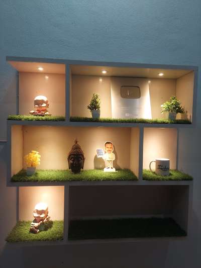 wooden showcase lighting and grass carpet