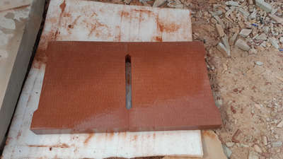 Red sand stone with ancient chiseling for drain cover