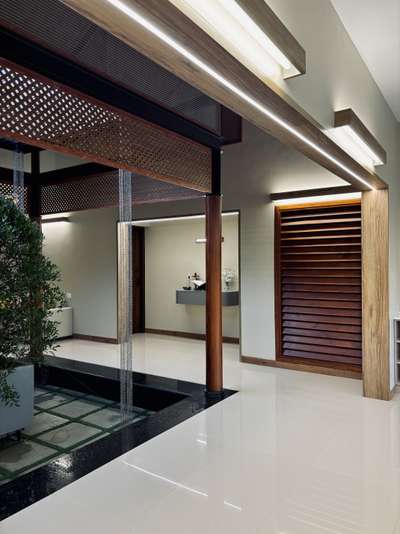 A warm, contemporary interior crafted with a strong architectural sensibility—defined by clean lines, muted tones, and seamless spatial flow. The open-plan layout connects dining and living areas effortlessly, enhanced by soft natural light and refined material layering. Subtle wood accents, custom detailing, and minimal surface treatments create a calm, sophisticated atmosphere tailored for everyday comfort.
This residence was developed in collaboration with PCA, combining thoughtful interior planning with a restrained, modern aesthetic.
2800 sqft | Client: Sibi | Location: Amboori, Trivandrum
#InteriorArchitecture #ContemporaryInteriors #ModernResidence #ArchitecturalDesign #OpenPlanLiving #MinimalInteriors #DesignDetails #TrivandrumHomes #koloproject