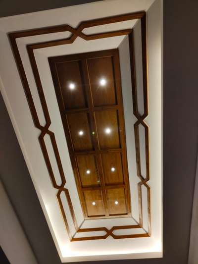gypsum ceiling with wooden paint finish..
low cost consumpt...
9544503030 #GypsumCeiling