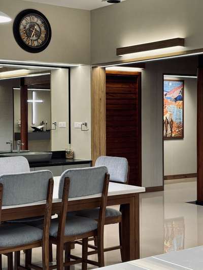 A warm, contemporary interior crafted with a strong architectural sensibility—defined by clean lines, muted tones, and seamless spatial flow. The open-plan layout connects dining and living areas effortlessly, enhanced by soft natural light and refined material layering. Subtle wood accents, custom detailing, and minimal surface treatments create a calm, sophisticated atmosphere tailored for everyday comfort.
This residence was developed in collaboration with PCA, combining thoughtful interior planning with a restrained, modern aesthetic.
2800 sqft | Client: Sibi | Location: Amboori, Trivandrum
#InteriorArchitecture #ContemporaryInteriors #ModernResidence #ArchitecturalDesign #OpenPlanLiving #MinimalInteriors #DesignDetails #TrivandrumHomes #koloproject