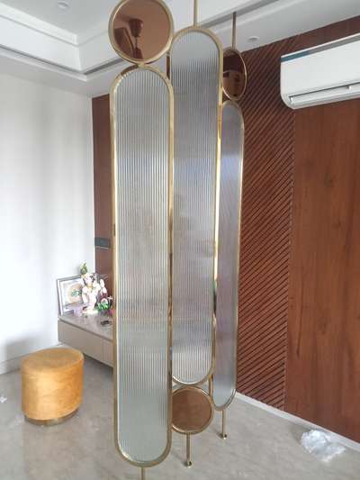 Oval shape partition work done in stainless steel with PVD coating exclusive design customized available for requirement