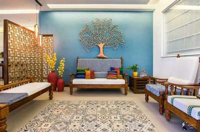 Create this desi look wiith a large metal tree wall decor that makes a statement along with coloured cushions to embellish the plain seating. Add a lot of terracotta pots for that earthy vibe. Consider investing in a wooden jaali partition as well to make the space intimate.
#interior #decor #ideas #home #interiordesign #indian #colourful 
#decorshopping