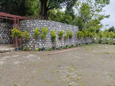 Stone Retaining Wall Work.. 
with material/Labour rate.