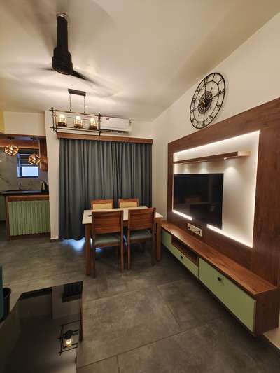 living and dining room interior done for a compact 1 BHK apartment at Nanma One Cochin including furniture and furnishing
 #interior
#LivingroomDesigns 
#diningroom
#tvunit
#LivingRoomSofa 
#DiningTable #DiningChairs 
#lighting #furnishing #furniture