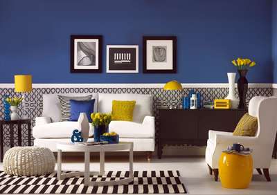 Get this blue living room with yellow accents by adding yellow table lamp, cushions, stool and flowers. Use white sofa along with a coffee table, off-white ottoman, contrast rug and vases to balance the colour pallette.
#interior #decor #ideas #home #interiordesign #indian #colourful #decorshopping