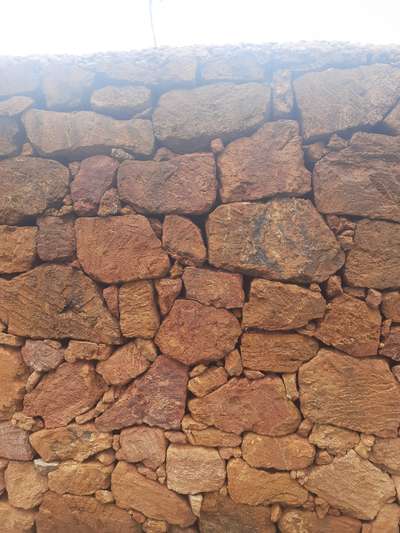 BOUNDARY WALL WITH UNSHAPE LATERITE