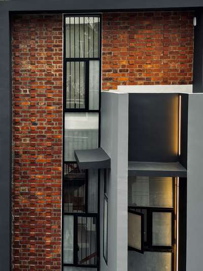A compact urban residence defined by exposed brick, clean grey volumes, and bold geometric lines. Thoughtful window placements, subtle landscaping, and a refined material palette create a warm yet contemporary architectural presence. A modern home crafted for simple, seamless city living 

#Architecture #ResidenceDesign #ContemporaryHome #BrickFacade #ModernArchitecture #UrbanLiving #ArchitecturalDesign #MinimalDesign #koloprojects