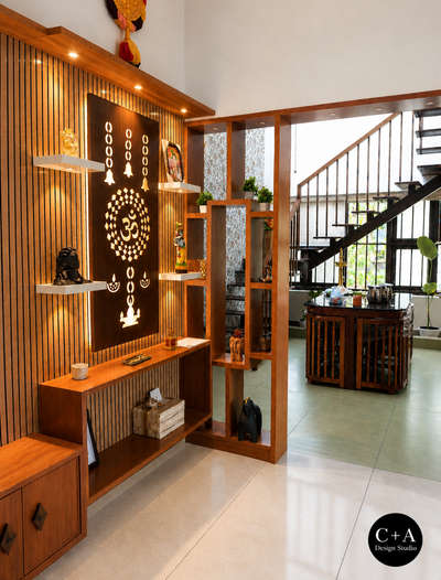 “A home where light, air & design meet beautifully ✨”

Mr. Anuraj Residence | Cherthala
A thoughtfully designed residence blending modern functionality with warm, earthy aesthetics. The space highlights natural light, ventilation, and material harmony, creating a calm and inviting living experience.
The double-height area with jaali wall design enhances airflow and diffused daylight, while the wooden staircase and textures add richness and warmth to the interiors. Carefully curated elements and greenery bring a subtle connection to nature.
Designed & Executed by C+A Design Studio
📍 Location: Cherthala
📐 Project Type: Residential Interior & Architecture
✨ Style: Modern with Traditional Touch
 
#C+ADesignStudio
#KeralaHomes
#KeralaArchitecture
#CherthalaHomes
#DreamHomeKerala
#ModernKeralaHome
#HomeDesignIndia
#InteriorDesignKerala
#HouseDesignInspiration
#IndianHomes
#LuxuryHomesKerala
#MinimalDesignIndia
#ContemporaryKerala
#ArchitectLif