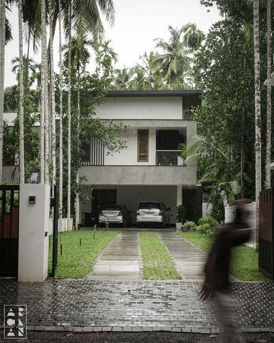 Even the simplest landscape can elevate the architectural beauty...

📍Calicut, Kerala 
Project type: Residence
Area:5400sqft
Completion year: 2025
.
.
.
 #calicutarchitects #architecturephotography #modernhome #driveway #ContemporaryHouse #elevation #frontElevation #architecture #gate #texturepaint