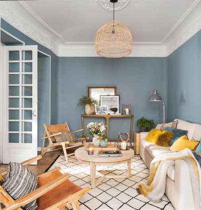 Give your space an elegant touch by painting your walls in greyish blue in contrast to light furniture in the room. Add leather armchair, wooden coffee table , ivory sofa and a light colour rug to complete the look. #interior #decor #ideas #home #interiordesign #indian #colourful #decorshopping