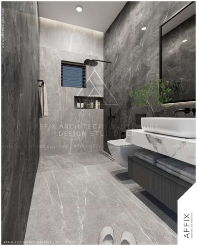 A sleek, modern bathroom dressed in grey marble finish with subtle white veining. Black matte fixtures, niche storage, and a floating vanity with under-shelf towels bring both elegance and practicality. Balanced lighting and a touch of greenery add to the serene atmosphere. #Architect  #architecturedesigns  #Architectural&Interior  #kerala_architecture  #best_architect  #toiletdesigns
