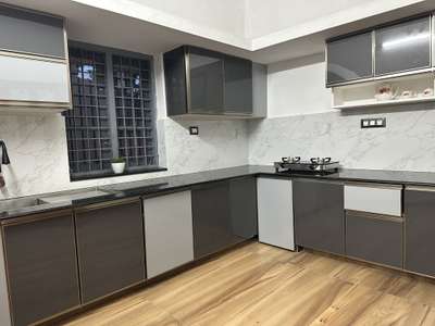 Kitchen cabinets using ferro cement &for doors using  aluminium profiles with pvc uv board