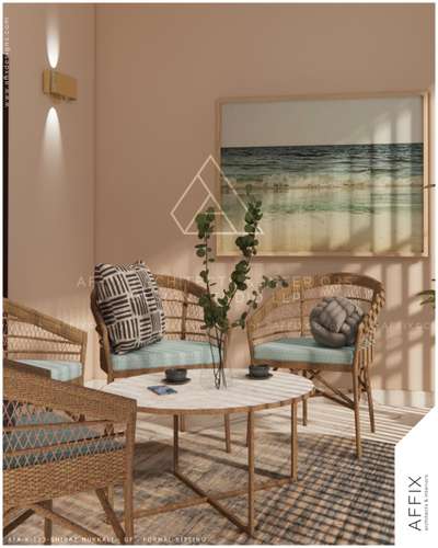 A cozy formal sitting area styled with woven furniture, soft pastel tones, and seaside artwork that evokes a calm and refreshing ambiance. Natural light enhances the warmth of the space, creating a perfect blend of comfort and elegance #Architect  #architecturedesigns  #Architectural&Interior  #architecturekerala  #kerala_architecture  #best_architect