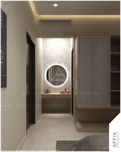 This modern dressing area features a clean recessed ceiling with hidden cove lighting and a textured feature wall. A bright backlit round mirror highlights the vanity table, making the space feel open. Tall built-in wardrobes with woven textures and dark wood doors provide plenty of storage. These architectural details make the space look elegant and high-end while keeping it warm, organized, and very practical. #Architect  #architecturedesigns  #Architectural&Interior  #kerala_architecture  #architecture_hunter