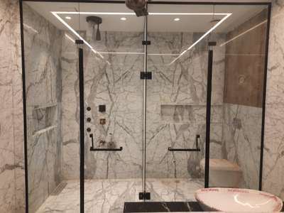 cubicle shower with black frame profile