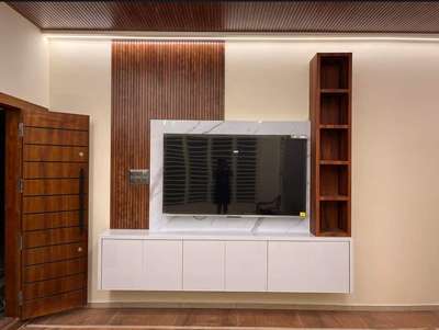 TV unit Marine ply 710 grade glossy Mica wooden panelling square feet 1000 only labour + 


material  #tvunitinterior