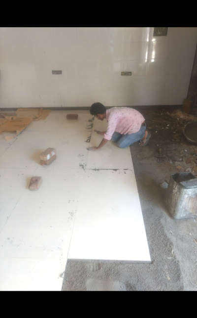 flooring tile work is going in budh vihar