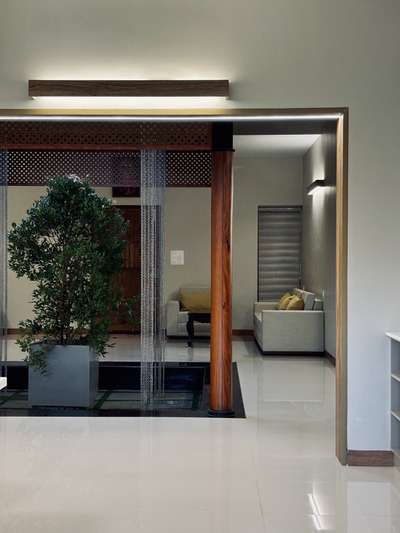 A warm, contemporary interior crafted with a strong architectural sensibility—defined by clean lines, muted tones, and seamless spatial flow. The open-plan layout connects dining and living areas effortlessly, enhanced by soft natural light and refined material layering. Subtle wood accents, custom detailing, and minimal surface treatments create a calm, sophisticated atmosphere tailored for everyday comfort.
This residence was developed in collaboration with PCA, combining thoughtful interior planning with a restrained, modern aesthetic.
2800 sqft | Client: Sibi | Location: Amboori, Trivandrum
#InteriorArchitecture #ContemporaryInteriors #ModernResidence #ArchitecturalDesign #OpenPlanLiving #MinimalInteriors #DesignDetails #TrivandrumHomes #koloproject