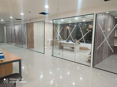 Black profile with glass partition work 550rs sqft floor spring fitting cost extra