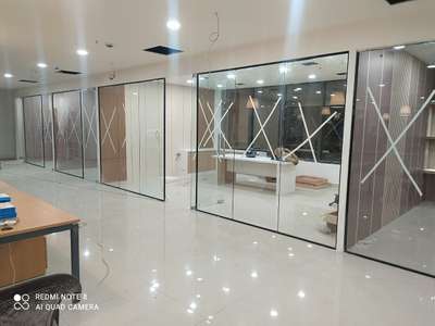 Black profile with glass partition work 550rs sqft floor spring fitting cost extra