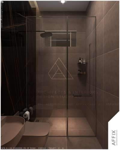 A sleek, modern bathroom with a bold dark stone wall, clean fixtures, and soft lighting—simple, elegant, and stylish. #Architect  #architecturedesigns  #Architect  #architectsinkerala  #best_architect