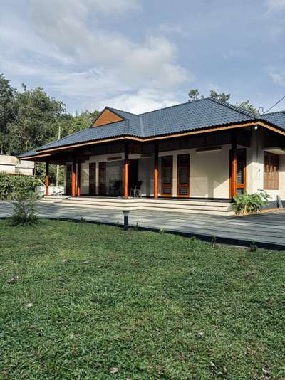 A contemporary take on traditional Kerala architecture, this residence brings together timeless proportions, pitched roofing, and warm wooden detailing with a refined modern sensibility. The long, symmetrical frontage opens into a calm and inviting central axis, creating a strong architectural presence rooted in regional context. Subtle material tones, deep verandah edges, and crafted lattice elements enhance both aesthetics and climate responsiveness.Developed in collaboration with PCA, the design blends tradition and modern comfort, creating a home that feels grounded, serene, and contextually connected.
2800 sqft | Client: Sibi | Location: Amboori, Trivandrum
#Architecture #KeralaArchitecture #ContemporaryTradition #ModernResidence #RegionalDesign #ArchitecturalDetails #CourtyardHome #TrivandrumHomes #koloproject