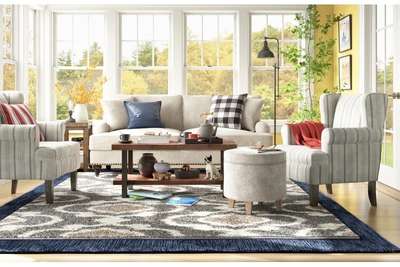Get this warm and bright living room with a warm grey tone with : grey sofa with soft stripes, gray ottoman, and a wooden 2 tier coffee table. Layer multiple area rugs to add depth and warmth.#interior #decor #ideas #home #interiordesign #indian #colourful #decorshopping