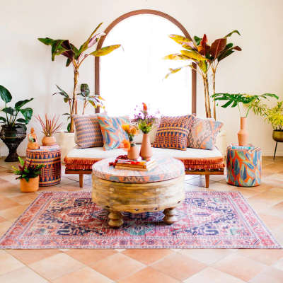 Mix up strong geometrics in the African style with modernised asian botanicals and traditional looking moroccan prints in a muted palette to get this very cohesive look. These boho printed cushions, terracotta pots and wooden coffee table adds to the effect.
#interior #decor #ideas #home #interiordesign #indian #colourful #decorshopping