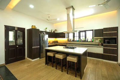 Island kitchen - Residence for Mr. Geo at Vaikom #islandkitchen #homedesignkerala #Architectural&Interior #KitchenIdeas