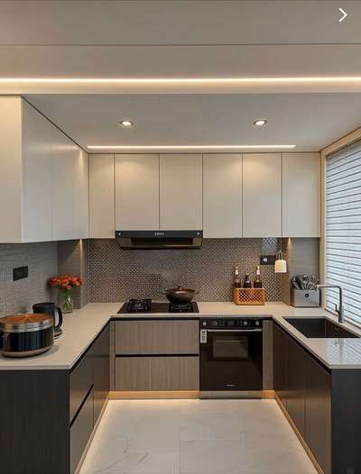 A modular kitchen is a contemporary approach to kitchen design, constructed with pre-made cabinet modules or units. These components are crafted from high-quality materials and fitted together seamlessly to optimize space, improve workflow efficiency, and deliver a clean, sophisticated aesthetic. #InteriorDesigner #architecturedesigns #KitchenIdeas #ClosedKitchen #LargeKitchen #LShapeKitchen #kolo #instagram