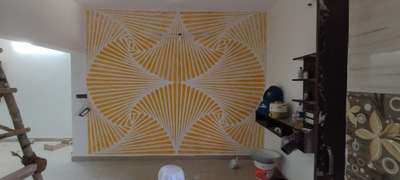Wall Putty design with yellow color.