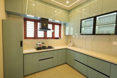#working@kannur #KitchenInterior #Acrylic #KitchenCabinet #multiwood #thalasseryinteriors