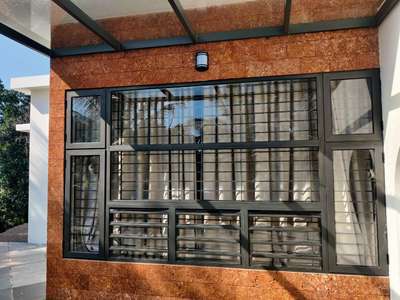 casement doors with jalusie window
toughened glass
hosten gray
complete site photo
@malappuram
.
.
.
 #hosten_aluminium_system #hosten_gray #system_windows  #premiumquality #germanstandard #powder_coated #costomized_product