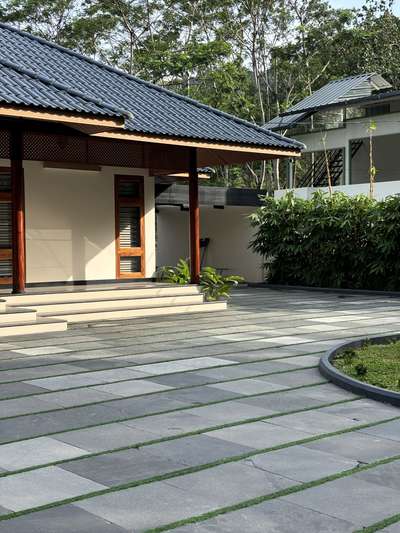 A contemporary take on traditional Kerala architecture, this residence brings together timeless proportions, pitched roofing, and warm wooden detailing with a refined modern sensibility. The long, symmetrical frontage opens into a calm and inviting central axis, creating a strong architectural presence rooted in regional context. Subtle material tones, deep verandah edges, and crafted lattice elements enhance both aesthetics and climate responsiveness.Developed in collaboration with PCA, the design blends tradition and modern comfort, creating a home that feels grounded, serene, and contextually connected.
2800 sqft | Client: Sibi | Location: Amboori, Trivandrum
#Architecture #KeralaArchitecture #ContemporaryTradition #ModernResidence #RegionalDesign #ArchitecturalDetails #CourtyardHome #TrivandrumHomes #koloprojects