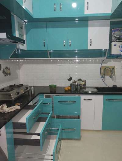*modular kitchen *
1000 rs. per sqft.. used wood. sunmica... center counter is also available for space storage.