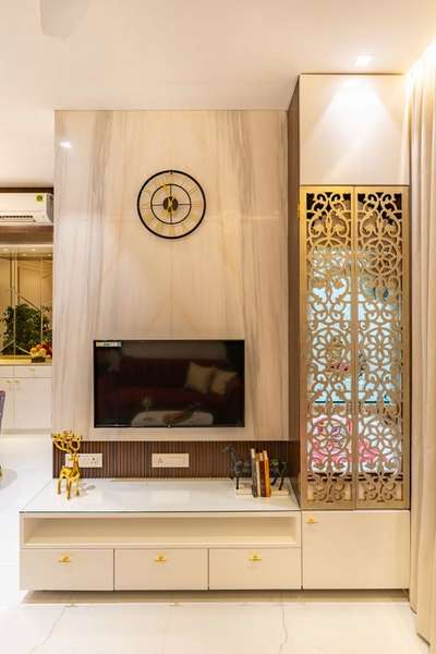 TV Unit With beautiful Mandir Designs You'll Love.Setting up a TV unit with a mandir is a convenient and innovative home design solution
#bhatiyainterior #modularkitchen #homerenovation #interiordesign #homedesignideas #mandir 
www.bhatiyainterior.com