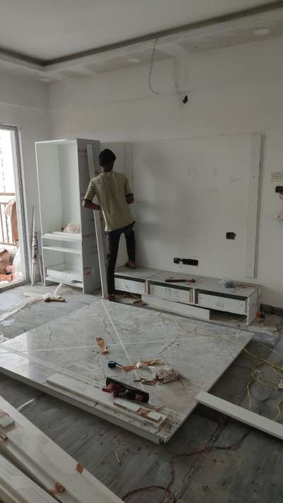 Installing a TV unit #InteriorDesigner #HouseDesigns 
#KeralaStyleHouse
