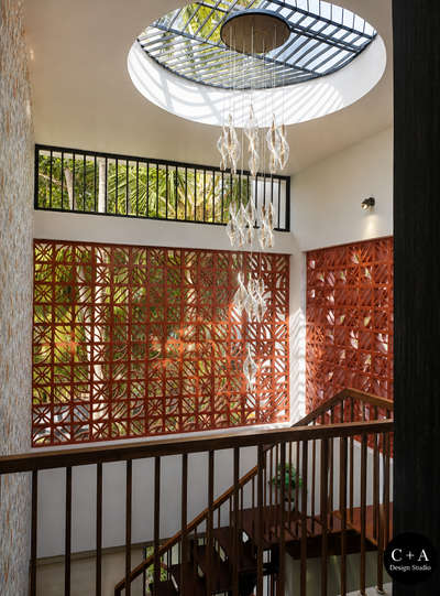 “A home where light, air & design meet beautifully ✨”

Mr. Anuraj Residence | Cherthala
A thoughtfully designed residence blending modern functionality with warm, earthy aesthetics. The space highlights natural light, ventilation, and material harmony, creating a calm and inviting living experience.
The double-height area with jaali wall design enhances airflow and diffused daylight, while the wooden staircase and textures add richness and warmth to the interiors. Carefully curated elements and greenery bring a subtle connection to nature.
Designed & Executed by C+A Design Studio
📍 Location: Cherthala
📐 Project Type: Residential Interior & Architecture
✨ Style: Modern with Traditional Touch
 
#C+ADesignStudio
#KeralaHomes
#KeralaArchitecture
#CherthalaHomes
#DreamHomeKerala
#ModernKeralaHome
#HomeDesignIndia
#InteriorDesignKerala
#HouseDesignInspiration
#IndianHomes
#LuxuryHomesKerala
#MinimalDesignIndia
#ContemporaryKerala
#ArchitectLif