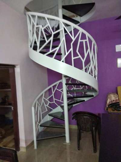 metal spiral staircase with attractive handrail