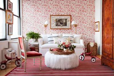 Get this red and white themes room with a subtle wallpaper of the same colour palette on the focus wall with wall lights framing the central gilded art frame. Invest in a striped rug and choose mostly white furniture with a statement chair standing out in red.
#interior #decor #ideas #home #interiordesign #indian #colourful