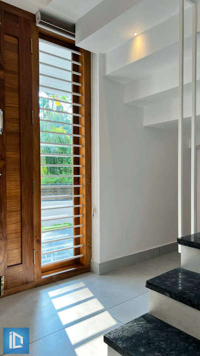 StaIr Area  #TeakWoodDoors  #StaircaseDecors #KeralaStyleHouse #FlooringTiles #architecturedesigns #CivilEngineer
