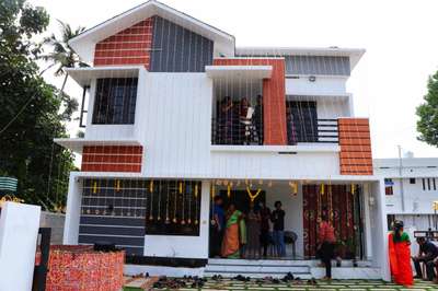 Our newly completed project.

total area :1480sqft

Client name : Sandhya A R 
Location : Elakamon, Varkala

 RRM foundation,two storey - contemporary style, Roof pergola, Balcony pergola, Top open terrace)
 
Ground Floor- 950 sqft(Sitout,Living hall,Dining room,wash counter, 1 bedroom with  attached toilet, Kitchen , Work area, Light roof )
First Floor - 530 sft(Family Living room, Balcony , 2 bedroom with attached toilet ,stair case area , Front and Back Open terrace)