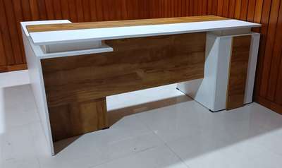 Reception Table/ MD Table 
CUSTOMISED DESIGN 
Engineered Wood 
Colour: Teak and white 
Material: Particle Board 

For more details please contact this number: 9544200511
                 9048126239
 #ParticleBoard #custamizedwork #custominterior #customisedfurniture #engineered #Wood #receptiontable #receptiondesign