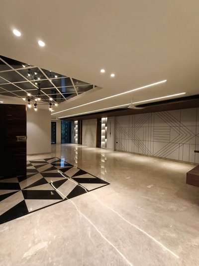 A beautiful combination of flooring and false ceiling with profile lights. #interiordesign #interiors #lights #flooring #flaseceiling #interiors #hall #luxuryinterior #profilelights #lighting #marble #interiorshapes #interiorshapesandesigns