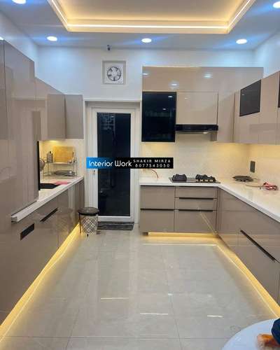 #ModularKitchen #LargeKitchen #WoodenKitchen #KitchenRenovation #KitchenTable #partitiondesign #inotechkitchen #acrelickitchen #RollingShutters #pantrycupboard #crockckeryunit #GlassDoors