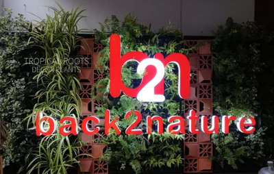 green wall with name boards#tropical roots landscaping#vertical garden#back to nature,tripunithura,kochi