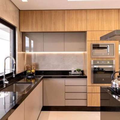 L shaped Modular kitchen 

L-shaped kitchen designs are a popular layout for modern homes. As the name suggests, this type of kitchen design features a layout that resembles the letter "L." This design typically involves installing kitchen cabinets and appliances in two perpendicular walls, leaving a clear and open space in the centre of the kitchen. L-shaped kitchen designs are advantageous because they provide ample counter space and storage while also creating an open floor plan that allows for easy movement and interaction between the kitchen and other living areas. Additionally, the corner area created by the perpendicular walls can be utilized for additional storage or countertop space. L-shaped kitchen designs are versatile and can be adapted to fit a variety of kitchen sizes and styles.

A Small Modular Kitchen With Two-Tone Cabinets And A Textured Wall

This L-shaped small modular kitchen design is perfect for small spaces and those who are looking for a modern and chic look.