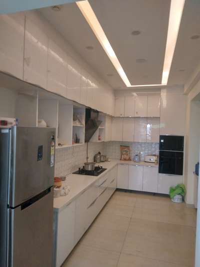 *Modular kitchen*
Ply with linen inside carcase
               Gloss sheet outer
               White at wallside
                @ 850/sqft
HDMR action tesa @1200 /sqft
For ignotech drawer 6000 per set
                       Or
Telescopic drawer @ 1000
Glass profile shutter @380
With black Matt aluminum profile

Pantry , pull down and rolling shutter will be cost as client demand 

White pearl quarts 600 sqft
HDMR decor @1000/sqft